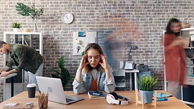 Zoom in time-lapse of employee suffering from headache in office at desk