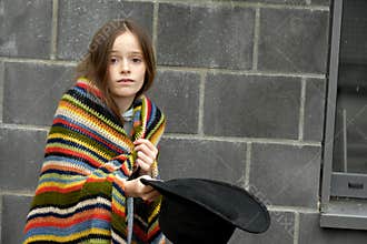 Beggar girl asking for a little money