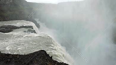 A torrent of water plummeting into a deep gorge. Waterfalls Of Iceland. The close-up shots.
