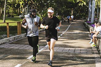 People jogging at park together