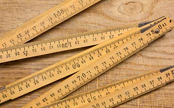 Measuring Stick on a Wooden Table