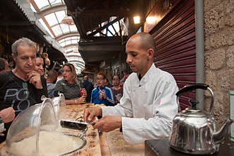 The chef prepares a dessert at the market in the city of Akko in Israel
