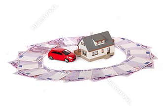Model house, car, and five hundred euro banknote