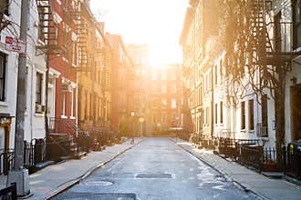Sunlight shines on historic buildings along Gay Street in New York City