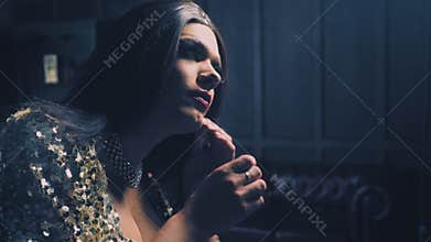 Travesty-diva. The concept of show transvestites. Man actor turns into a woman. he puts on women`s clothes. 4k, slow