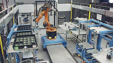 Robot working in an electronics manufacturing facility
