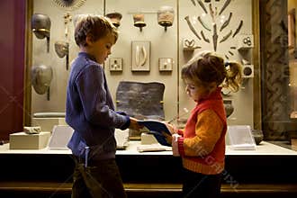 Boy and girl at excursion in historical museum