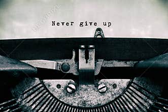 Never give up words typed on a vintage typewriter