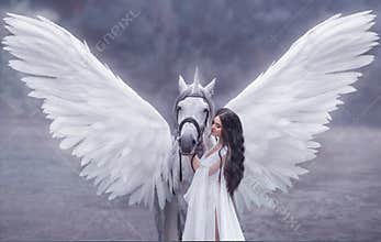 Beautiful, young elf, walking with a unicorn. She is wearing an incredible light, white dress. Art hotography