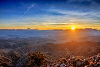 Sunsets Rays Beaming Over Mountains
