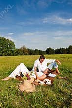 Summer picnic - Happy couple in meadow