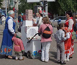 Competition of baby carriages on a City Day
