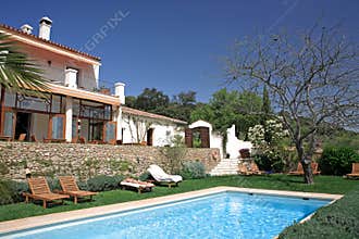 Luxury rustic hotel and swimming pool in countryside