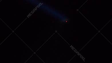 Tug looking spotlight red anchor buoy in dark. AHTS work