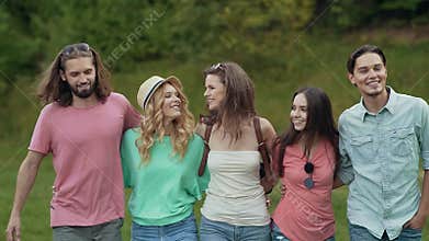 Happy friends having fun outdoors in nature.