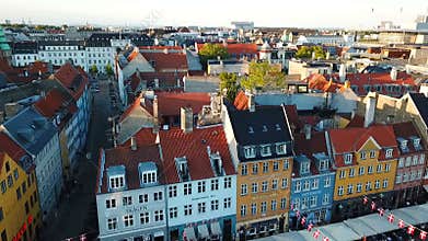 Sunset footage video from Copenhagen, Denmark. Nyhavn New Harbour canal and entertainment district. Aerial Video footage