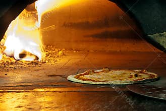 Italian pizza in a wood burning oven