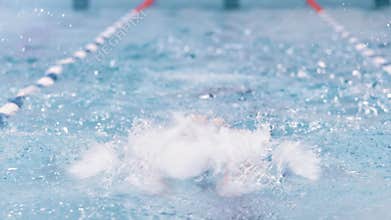 Full shot front view professional male swimmer performing butterfly stroke having training