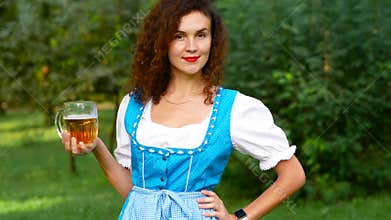 Portrait of attractive bavarian girl with beer
