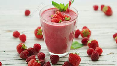 Strawberry smoothie in glass with mint