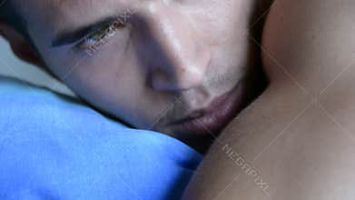 Young Sleepy Man, Lying in Bed Waking Up