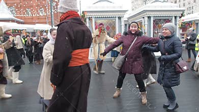 MOSCOW, RUSSIA- FEBRUARY 2017: Shrovetide festivities in Moscow. People are having fun on the Shrove Tuesday in Russia. Passersby