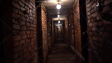 walking through a gloomy long basement with lanterns tunnel closing doors brick walls inspiring despair and horror