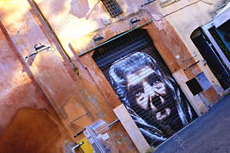 Old lady graffiti portrait somewhere in the street