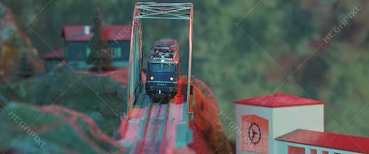 Locomotive and wagons coming down the hill and going to the train station
