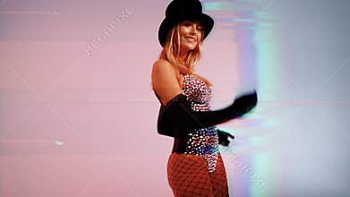 Young woman wearing top hat with sparkly costume