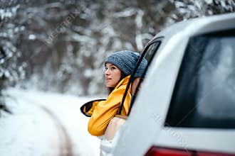 Hipster girl admire snowy road