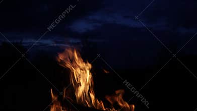 fire crackling against the evening sky