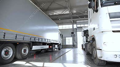 A refrigerated lorry pulls into a service station for annual service.