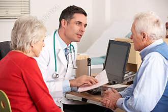 American doctor talking to senior couple