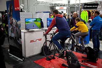 Ukraine, Kiev - February 20, 2020: Cycling simulator. Indoor computer game for cycling at home. Exercise bike. Exhibition for sale