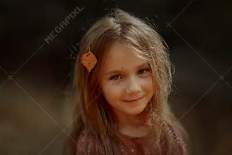 Smiling girl cutest autumn portrait with  leave