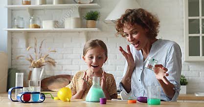 Mother and daughter playing with chemistry hands-on kit