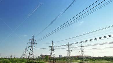 Four power energy lines of high-voltage transmission pylons with industrial background and clear blue sky. Illustration