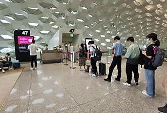 Travelers with masks boarding in line, Shenzhen, China