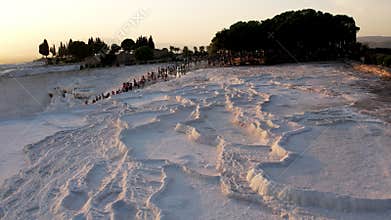 Aerial view of the travertines in Pamukkale in a beautiful sunset, Turkey. White limestone mineral formations. Turkish