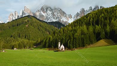Santa Magdalena village with church Church of St. John in Dolomites mountains, Val Di Funes, Trentino Alto Adige, Italy