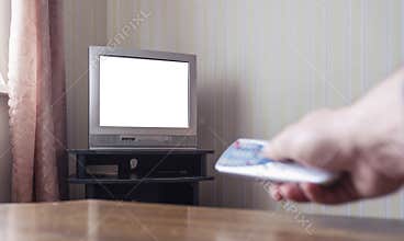 Person hand holding in hand remote control from old tv set with mock up white space