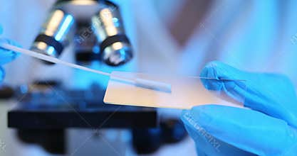 Biological tests have been carried out and a swab is examined for analysis.