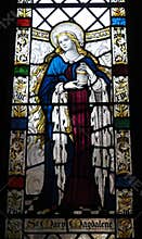 Stained glass window of Saint Mary Magdalene in the cloisters of Chester Cathedral