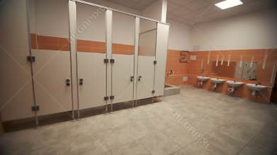 Interior of public toilet with stalls in private school