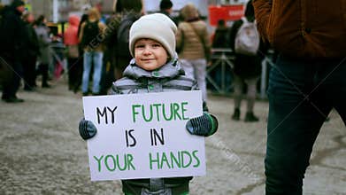 My future your hands protest banner. Cute little activist boy hold eco placard.