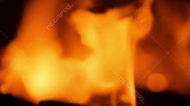 The intense heat of the flames radiates as they roar and crackle with fiery energy..