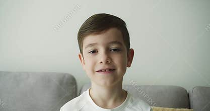 Portrait at home indoors little school boy cute son pupil schoolboy child kid male baby schoolkid orphan smiling looking