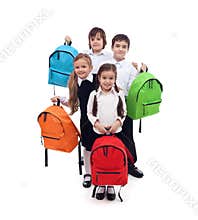 Group of happy kids with colorful school bags