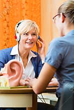 Deaf woman takes a hearing test